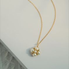 This exquisite piece features a delicate clover pendant adorned with intricate details, symbolizing good fortune and prosperity. Crafted with meticulous attention to detail, the necklace exudes elegance and sophistication. Whether worn for everyday elegance or special occasions, this necklace adds a touch of whimsical beauty to any ensemble. Metal: 14K Gold Filled Gemstone: Freshwater Pearl Chain Diameter: 450mm(includes adjustable chain) Gold Clover Necklace, Mother Of Pearl Clover Necklace, Clover Pendant, Clover Locket, Elegant 14k Gold-filled Pearl Necklace With Charm, Clover Necklace, Lucky Clover, Charm Pendant Necklace, Pearl Chain