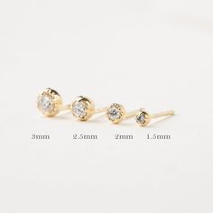 The perfect dainty 14k solid gold diamond studs to jazz up your everyday look. Every woman needs one pair of simple diamond studs to add to their collection. This classic earring makes a sophisticated accessory for women of all ages. Purchase this versatile studs for special occasions such as birthdays, anniversaries, Christmas, Mother's Day, Valentine's Day, or even for bridesmaids! * Sold as a single stud or a pair * 1.5mm diamond weighs 0.015ct, for a pair 0.03ctw. * 2mm diamond weighs 0.04ct Minimalist Anniversary Piercings With Diamond Accents, Minimalist Everyday Diamond Piercings, Everyday Minimalist Diamond Piercings, Dainty Diamond Piercings For Everyday, Classic Diamond Piercings For Everyday Wear, Dainty Everyday Diamond Piercings, Everyday White Gold Diamond Cartilage Earrings, Minimalist Diamond Wedding Piercings, Minimalist White Gold Diamond Piercings