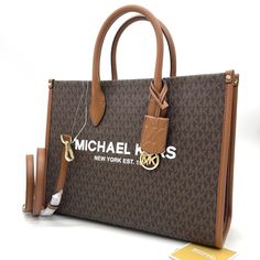 Brand New With Tag Michael Kors Medium Mirella Ew Tote Bag Product Details About This Item Color: Brown Fabric Type 100 % Polyester Origin Imported Gold-Tone Hardware 15.75”W X 14”H X 7.75”D Handle Drop: 5.25” Adjustable Strap: 20.5”-24.25” Interior Details: Back Zip Pocket, 2 Front Slip Pockets Lining: 100% Polyester Description Details Tote Bag Logo Pvc Leather Gold-Tone Hardware 15.75”W X 14”H X 7.75”D Handle Drop: 5.25” Adjustable Strap: 20.5”-24.25” Interior Details: Back Zip Pocket, 2 Fron Michael Kors Packaging Gift Bags, Brown Tote Bag Outfit, Bougie Lifestyle, Mk Tote Bag, Tote Bag Outfit, Bag Logo, Brown Tote Bag, Michael Kors Tote Bags, Carryall Tote