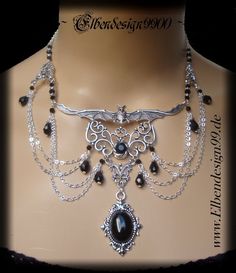 A very elegant choker in gothic style, which, like all my jewelry, was made with great care and attention to detail. The necklace was made from silver-plated metal ornaments with black faceted glass beads and black glass stones. Black diamond rhinestones were also used. The chain is adjustable from approx. 39 cm-46 cm, with a black drop hanging on the extension chain. Silver Vampire Style Necklace, Gothic Silver Necklaces For Festival, Silver Fantasy Choker Necklace, Gothic Silver Festival Jewelry, Gothic Silver Jewelry For Festival, Gothic Metal Necklace, Handmade Silver Gothic Choker, Silver Vampire Choker For Halloween, Silver Fantasy Necklace For Halloween