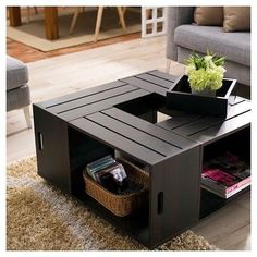 a coffee table with a basket on top and magazines in the bottom shelf next to it