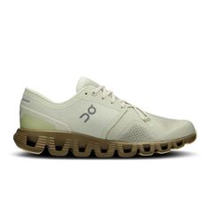 the on cloud running shoe in white with gum soles and light brown rubber outs