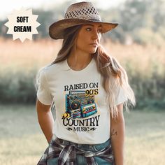 Perfect for your summertime concerts! Country music tshirt country western concert tee cowgirl shirts for women trendy graphic rodeo tee raised on 90s country music cowboy farmer southern living.  This super soft, comfortable t-shirt makes a very thoughtful and perfect gift! Your friends and family will love this unique gift for any occasion! Give this shirt for a birthday, for Christmas, a honeymoon, for mother's day, for father's day, for Valentine's day, or any special occasion for your bff or your family. This is a sure way to put a smile on the face of someone you love! Product description: BELLA + CANVAS 3001 UNISEX -Classic unisex jersey short sleeve tee fits like a well-loved favorite. -Soft cotton and quality print. -Ribbed knit collars to bolster shaping. -The shoulders have tapi 90s Country Music, 90s Country, Cowgirl Shirts, Concert Tees, Country Western, Cow Girl, Cow Boy, Rodeo, Country Music