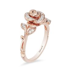 She'll treasure this delightful diamond rose ring from the Enchanted Disney Fine Jewelry Collection inspired by Belle. Fashioned in precious 10K rose gold This bold sculpted design features a blooming rose sparkling with diamonds along the petals. The ring's shank is created from elegant polished stems and diamond-touched leaves. Crown insets lower down the shank complete the look. This 1/10 ct. t.w. diamond ring predicts a bright future together. ©Disney Disney Engagement Rings, Enchanted Disney, Disney Belle, Enchanted Disney Fine Jewelry, Belle Disney, Crystal Jewelry Sets, Necklace Ring, Rose Ring, Disney Jewelry