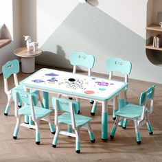 a child's table and chairs in a room