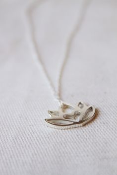 An original Lola&Cash protea necklace featuring a hidden heart -- d e t a i l s -- -protea measures 2cm wide -hand sawn out of solid sterling silver -completed in a mirror finish -includes a 45cm chain This pendant is also available in gold as seen in last picture https://www.etsy.com/listing/621948340/gold-protea-pendant-solid-9ct-yellow?ref=shop_home_active_1 -All Lola&Cash jewellery will arrive gift wrapped ---------------------------------------- Please Note - Made to order - Rush or Delicate Silver Necklace For Meditation, Spiritual Lotus Flower Necklaces For Gifts, Delicate Small Jewelry Gift, Spiritual Lotus Flower Necklace Gift, Delicate Jewelry For Gifts, Small Minimalist Necklace As A Gift, Small Minimalist Necklace Perfect For Gifts, Delicate Silver Charm Necklaces For Bridesmaids, Small Minimalist Necklace For Gift