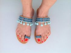 Boho Sandals, Ethnic Sandals, Hippie Sandals, Greek Sandals, Pom Pom Sandals, Party LookAmazing handmade boho leather sandals!!!Vivid summer colors are a mood booster!Blue is a summer color that make you dream on holidays and sea! It's the ideal pair of shoes when you can not carry many things with you because really matches any outfit and style!It's the perfect bohemian addition to your wardrobe!These light blue sandals are very easy to wear from office to drinks. It's perfect for the woman who Leather Tassel Sandals For Beach, Handmade Barefoot Sandals For Spring And Summer, Bohemian Round Toe Sandals For Beach Season, Leather Sandals With Tassels For Vacation, Hippie Style Barefoot Sandals For Summer Vacation, Hippie Barefoot Sandals For Summer Vacation, Bohemian Flat Sandals For Beach, Bohemian Open Toe Sandals For Summer, Bohemian Toe Loop Sandals For Spring