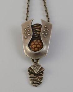 "This mixed-metal necklace was hand made by me in my studio. The PMC fine silver components in this necklace were hand sculpted in PMC, bronze and copper metal clay, kiln fired, buffed, and hand finished in my studio. The main fine silver element has been set with a bronze/copper clay \"cabochon.\" The sterling silver link chain has a lobster claw clasp.  Metal clay is comprised of tiny particles of fine silver, bronze or copper suspended in a binder. The binder burns away when the piece is fire Clay Cabochon, Clay Kiln, Silver Element, Copper Clay, Silver Link Chain, Wave Necklace, Glass Drop Earrings, Metal Clay Jewelry, Turtle Necklace