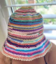 Introducing our fabulous Multi-Colored Crochet Bucket Hat, a groovy accessory that adds a touch of style to any outfit. Handcrafted with love and attention to detail, this hat is a true statement piece. Whether you're a fashion enthusiast or simply looking for a unique Mother's Day gift, this hat is the perfect choice. Featuring a delightful blend of vibrant colors, this hat exudes a playful and eye-catching appeal. The intricate crochet work showcases the craftsmanship and dedication that goes Trendy Crochet Adjustable Hat, Festival Crochet Mini Hat With Adjustable Fit, Hand Knitted Adjustable Mini Hats For Spring, Adjustable Crochet Mini Hats For Festivals, Adjustable Hand Knitted Mini Hats For Spring, Adjustable Hand-knitted Mini Hats For Spring, Trendy Multicolor One-size Crochet Hat, Bohemian Knitted Beach Hats, Trendy Multicolor Crochet Hat One Size