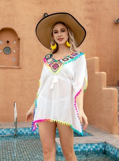 Accentuate your summer vibe! Introducing our ethereal white cover-up, a masterpiece of beachside fashion. Its sheer fabric whispers against the skin, offering a tantalizing glimpse of your swimwear while providing a tasteful layer of modesty. The deep V-neckline, cinched at the waist, flatters every figure, drawing attention to the delicate drawstring tie adorned with tiny, charming beads. The billowy sleeves add a touch of whimsy and sophistication, allowing for a comfortable fit as you stroll Beachwear Swim Dress For Beach Season, Summer Beachwear Swim Dress For Pool, Multicolor Swim Dress For Poolside Summer, White Sleeveless Beach Dress For Resort Season, Multicolor Summer Swim Dress For Beach, Multicolor Swim Dress For Summer Beach Party, Summer Beachwear Swim Dress, Bohemian Free Size Swimwear For Beach Party, Beach Season Beachwear Dress