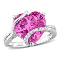 Introducing the captivating Created Pink Sapphire and Diamond Accent Heart Wrapped Ring in Sterling Silver, a stunning symbol of love and elegance. This enchanting ring features a heart-shaped Created Pink Sapphire, totaling 7 1/4 carats, embraced by a delicate wrapping of sparkling Diamond Accents. Crafted with precision in Sterling Silver, the ring exudes sophistication and modern charm. The combination of the vibrant pink sapphire and the shimmering diamonds creates a romantic and timeless de Heart Shaped Promise Ring With Diamond Accents, Fine Jewelry Heart Promise Ring For Valentine's Day, Heart Cut Fine Jewelry Ring For Valentine's Day, Valentine's Day Fine Jewelry Promise Heart Ring, Valentine's Day Diamond Accents Heart Promise Ring, Valentine's Day Fine Jewelry Heart Promise Ring, Double Heart Ring For Valentine's Day Promise, Heart Cut Jewelry For Valentine's Day Proposal, Heart Cut Promise Ring For Mother's Day