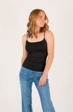 + solid black+ four way stretchy+ subtle round neckline+ buttery soft - 92% nylon 8% spandex+ stretchy & holds shape well *fits sizes 0-10 Fitted Black Tank Top With Built-in Bra, Black 4-way Stretch Tops For Spring, Black Camisole With Built-in Bra For Layering, Black Stretch Camisole With Built-in Bra, Trendy Fitted Camisole For Everyday, Fitted Black Camisole Top, Trendy Stretch Camisole For Layering, Seamless Solid Camisole Fitted Top, Black Scoop Neck Elastane Tank Top