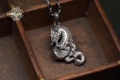 **Silver chain not included ** Click this link to shop our silver chains: https://www.etsy.com/hk-en/shop/silversmithhk?ref=l2-about-shopname&section_id=37505143 Dragon pendant without chain Material: 925 Silver Made in Hong Kong Designed by Ivan Keung Swan Necklace, Silver Swan, Phoenix Pendant, Silver Dragon, Dragon Pendant, Silver Work, Sterling Silver Pendants, Silver Pendant, Silver Color