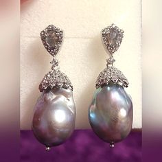 13-15mm Gray Cultured Freshwater Pearl. .85ctw Pear Shape Labradorite And 1.85ctw Round White Topaz Rhodium Over Sterling Silver Earrings. Measures Approximately 1.56"Lx0.50"W, With Push Back Backings. Color/Shape/Size Varies. No Longer Available In Stores. Selling Late Mother-N-Law's Items. Feel Free To Make Offers Pear-shaped Pearl Gemstone Earrings For Formal Occasions, Formal Pear-shaped Pearl Gemstone Earrings, Formal White Gold Pearl Earrings With Gemstone, High Luster Teardrop Sterling Silver Jewelry, Silver Pear Shaped Jewelry For Formal Occasions, Formal Silver Pear-shaped Jewelry, Formal High Luster Sterling Silver Earrings, Formal Pear-shaped Silver Jewelry, Luxury Silver Pearl Drop Earrings