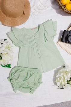 Introducing the Baby Abigail Dress Set, a summer delight for your little sunshine! Crafted from cool green cotton, this set features a darling round neckline with pleated detailing and sweet short flutter sleeves. Complete with a knee-length skirt and matching bloomers, plus functional buttons down the front, it's perfect for picnics in the park and sunny strolls with your little one. Available in sizes 0-3 months, 3-6 months, 6-9 months, + 9-12 months!! baby dress, summer baby outfit, summer Abigail Dress, Cool Green, Summer Baby Clothes, White Dress Party, Bridesmaids And Groomsmen, Girls Dresses Summer, Flutter Sleeve Dress, Dress Set, Everyday Dresses