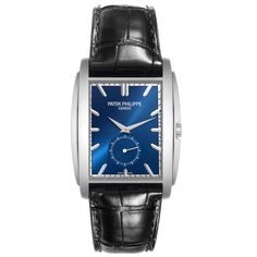 Patek Philippe Gondolo Small Seconds White Gold Blue Dial Mens Watch 5124 Papers. Manual winding movement. 18K white gold rectangular case 43 mm x 33.4 mm. Transparent exhibition sapphire crystal case back. . Scratch resistant sapphire crystal. Blue sunburst dial with raised baton hour markers. White gold dauphine hands. Small seconds sub dial at 6. Blue leather strap with Patek 18K white gold tang buckle. Blue Rectangular Timeless Watch, Timeless Blue Rectangular Watch, Blue Rectangular Business Watches, Classic Blue Rectangular Watch Accessories, Luxury White Gold Business Watch, Classic Diamond Watch With Subdials, Rectangular, Classic Diamond Watch With Rectangular Dial And Subdials, Classic Rectangular Watches With Subdials, Leather Chronograph Rectangular Watch