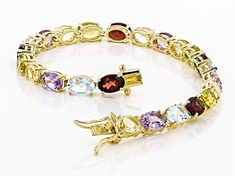 4.68ctw oval red garnet with 3.19ctw oval yellow citrine, 4.25ctw oval blue topaz, 3.19ctw oval amethyst and 2.55ctw oval peridot 18k yellow gold over sterling silver line bracelet. Measures approximately 0.20"W. Box clasp with double safety closure. Multi Gemstone Bracelet, Mother Daughter Gifts, Wedding Jewelry Bracelets, Box Clasp, Yellow Citrine, Unique Bracelets, Sterling Silver Bracelet, Red Garnet, Wedding Bracelet