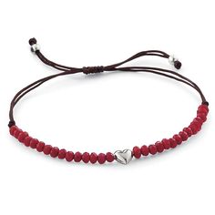 a red cord bracelet with a silver heart charm