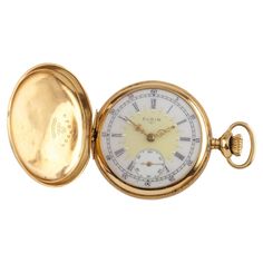 Beautiful Antique Elgin Pocket Watch w/ White Dial Including Gold Color Hands & Dedicated Second Dial 18K Yellow Gold Case w/ Intricate enamel design in center of dial Black Roman Numerals Case Serial # 5065513 7-Jewel Elgin Movement Serial # 13305507 Grade # 208 Estimated Year of Production: 1908 Total Mass = 32.6 grams Size 0S Piece Appears in Good Condition. Dial looks good. Mechanism Appears to not be Working. Time-keeping accuracy is untested. Buy As-Is. No Guarantees. Sell Coins, Gold Pocket Watch, Watch Trends, Sell Gold, Coin Jewelry, Gold Case, Jewelry Companies, White Dial, Roman Numerals