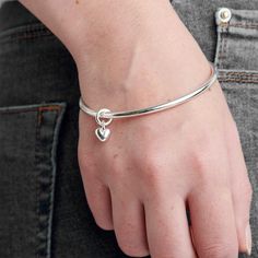 Our recycled silver Sweetheart Bangle is more than just an accessory. It's a talisman, a heart-shaped reminder to follow the beat of your heart. A solid silver bangle finished with a free-moving heart handmade in recycled solid sterling silver FREE UK DELIVERY. Map Jewelry, Womens Bangles, Bangles Making, Sterling Silver Anklet, Gold Earrings Designs