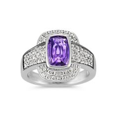 Fall in love with this queenly ring design showcasing one center cushion cut lavender natural sapphire  at 2.07 carats. This ring is part of our One-Of-A-Kind collection and is embellished by 66 round natural diamonds  at .72 carat TW  pavé-set in quality 14 karat white gold. The total gem weight is 2.79 carats and is sure to take her breath away. Diamond Pave Ring, Lavender Sapphire, Round Diamond Ring, Pave Diamond Ring, Pave Ring, Natural Sapphire, Sapphire Diamond, Showcase Design, Cushion Cut