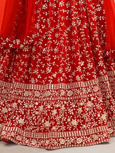 Fill vibrant hues in the upcoming wedding season with our captivating "attractive red embroidered georgette wedding wear lehenga choli" from Ethnic Plus. This stunning red lehenga choli ensemble is the perfect choice for your weddings, receptions, and other special occasions. With its rich red color and intricate embellishments, you are sure to make a lasting impression wherever you go.
The lehenga features a beautiful georgette material adorned with sequin work, zari work, and embroidery detail Red Chinon Gown With Zari Work, Festive Embroidered Chinon Lehenga, Red Georgette Traditional Wear With Dori Work, Red Semi-stitched Anarkali Set For Wedding, Red Anarkali Gown In Chinon, Red Choli For Wedding On Eid, Wedding Red Semi-stitched Anarkali Set, Red Choli For Wedding And Eid, Red Chinon Gown For Eid