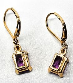 Pink Sapphire faceted open work gold over sterling silver vermeil earrings. Good used condition with little to no signs of normal vintage wear. Prong set emerald cut pink sapphire earrings. Stamped on the back 925 with a wave hallmark and China. Acid tests positive for sterling silver. Gemstone tested with Presidium II gemstone tester. Glows under UV light. Earrings measure 1 inch tall and 1/4 of an inch wide. Gold Plated Rectangular Gemstone Jewelry, Gold Plated Gemstone Jewelry In Rectangular Shape, Rectangular 14k Gold Collectible Jewelry, Dainty Rectangular Jewelry For Formal Occasions, Costume Jewelry Yellow Gold Earrings For Gift, Yellow Gold Costume Jewelry Earrings For Gift, Classic Gold Plated Jewelry With Lever Back Ear Wires, Vintage Drop Earrings With Prong Setting, Gold Dangle Jewelry With Prong Setting