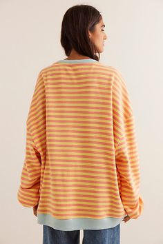 So cool and classic, this timeless crewneck is featured in an oversized, slouchy silhouette and staple striped print with contrasting hems for added dimension. **Fit:** Relaxed, oversized fit **Features:** Crew neckline, dropped shoulders, contrast hems **Why We | Classic Striped Oversized Crewneck by We The Free at Free People in Orange, Size: L Relaxed Fit Crew Neck Top With Striped Cuffs, Oversized Retro Sweatshirt, Striped Crew Neck Sweatshirt For Loungewear, Striped Crew Neck Sweatshirt For Spring, Oversized Tops With Striped Collar For Fall, Oversized Top With Striped Hem, Oversized Tops With Striped Hem For Spring, Oversized Retro Sweatshirt For Spring, Retro Oversized Sweatshirt For Spring