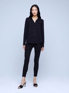 A modern classic. The Nina blouse is structured in all the right places with a relaxed, flattering fit. Refined button-down construction with a chic open collar and draped long sleeve in black silk. Timeless Spread Collar Blouse For Work, Timeless Office Blouse With Lapel Collar, Sleek Spread Collar Blouse For Work, Sleek Blouse With Spread Collar For Work, Timeless Collared Blouse For Work, Chic Business Casual Blouse With Lapel Collar, Elegant Black Blouse With Shirttail Hem, Tailored Button-up Blouse For Business Casual, Sleek Viscose Blouse For Fall