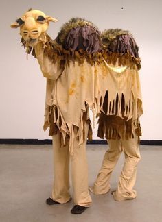 two people dressed in costumes standing next to each other