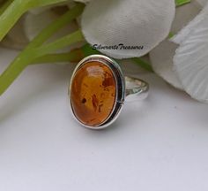 Natural Amber Ring, Amber Gemstone Ring, Beautiful Amber Ring, Amber Stone Jewelry, November Birthstone Ring, 925 Silver Ring, Stylish Ring Amber Stone Benefits Amber helps to balance the emotions, clear the mind and release negative energy. It aids manifestation, eases stress by clearing phobias and fears, and it's a lovely warm stone to wear Yellow amber has been used traditionally by natural healers to improve memory, increase mental flexibility and create balanced decision-making. Amber has Amber Open Ring For Anniversary, Classic Amber Rings For Gifts, Amber Wedding Rings With Polished Finish, Amber Cabochon Ring For Anniversary, Amber Sterling Silver Rings For Anniversary, Amber Rings For Anniversary In Fine Jewelry Style, Amber Cabochon Jewelry For Wedding, Amber Cabochon Wedding Jewelry, Hallmarked Amber Jewelry For Anniversary