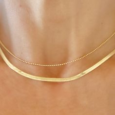 "This necklace is liquid gold luxury! Beautiful, Elegant, High Quality 18k Gold filled Herringbone Chain MODEL is wearing our 16\" Herringbone necklace, layered with our 1.2mm 15\" gold ball necklace - - Ball chain is sold separately - link to ball chain necklace below: - Model Neck circumference is 12.5\" - Not all necks are not created equal - Please measure your neck to ensure proper fit. - NECKLACE SIZE : Please measure your neck for correct necklace size before ordering to ensure proper fit Gold Ball Necklace, Gold Herringbone Necklace, Gold Herringbone Chain, Gold Snake Chain, Real Gold Jewelry, Herringbone Chain, Herringbone Necklace, Snake Chain Necklace, Ball Chain Necklace