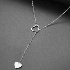 This Heart Lariat necklace it's perfect for everyday use , you can wear it with jeans or for a special event. The necklace is totally handmade the base material is 14k or 9k Solid Gold,Yellow,White or Rose gold Metal information and dimensions details: ---------------- Width : 10.00x11.50mm & 7.50mmx9.50mm Metal: Solid 9K Yellow ,White or Rose gold or Solid 14K Yellow ,White or Rose gold Solid gold chain 9k Yellow,White or Rose gold or Solid gold chain 14k Yellow,White or Rose gold The chain Valentine's Day Heart Charm Lariat Necklace, Elegant Lariat Heart Necklace Gift, Adjustable Lariat Necklace With Heart Charm, Heart Pendant Lariat Necklace For Valentine's Day, Minimalist Adjustable Heart Necklace, Valentine's Day Heart Pendant Lariat Necklace, Silver Heart-shaped Lariat Necklace With Adjustable Chain, Dainty Heart Charm Lariat Necklace, Dainty Lariat Necklace With Heart Charm