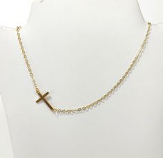 Cross gold steel necklace, Layering jewelry, Religion cross choker, Gold necklace, Minimalist jewelry, Dainty cross choker, Tiny necklace Beautiful simple necklace with gold stainless steel cross and steel chain. Simple choker or everyday wear Length 42cm  The necklace will be delivered inside a craft jewelry box. JEWELRY CARE: Please take care of your jewelry do not wear in the shower, swimming pool, or to bed. Keep away from harsh chemicals and cleaners. It is always best to put on your jewelr Minimalist Clavicle Chain Crucifix Jewelry, Minimalist Crucifix Jewelry With Delicate Chain, Minimalist Crucifix Clavicle Chain Jewelry, Minimalist Cross Charm Necklace With Delicate Chain, Simple Cross Jewelry With Delicate Chain, Minimalist Clavicle Cross Chain Jewelry, Minimalist Crucifix Jewelry With Adjustable Chain, Minimalist Charm Necklace With Cross Pendant, Minimalist Charm Necklace With Cross Pendant And Adjustable Chain