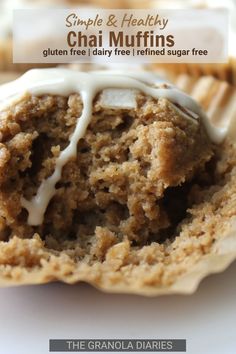 a muffin with white icing sitting on top of it