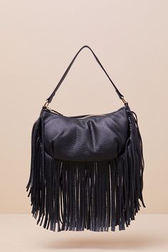 Spend Friday nights out on the town with the Bold Agenda Black Fringe Shoulder Bag! Pebbled faux leather shapes this elevated bag that features a crescent silhouette with a flat bottom design and a slender shoulder strap. Undo the top zipper to reveal a roomy, lined interior with a zippered sidewall pocket. Fun long fringe adorns the bottom of the bag for an eye-catching finish! Bag Measures 9. 5" Wide, 5. 25" Tall, And 3. 5" deep (Relaxed). 14" Shoulder Strap. Strap Has A 7. 25" DropLined. 100% UP. Imported. Lulus | Bold Agenda Black Fringe Shoulder Bag. Trendy Hobo Bag With Adjustable Strap For Party, Faux Leather Shoulder Bag With Zipper For Party, Chic Fall Bags For Night Out, Evening Faux Leather Hobo Bag With Removable Pouch, Leather Shoulder Bag With Removable Pouch For Night Out, Leather Shoulder Bag With Zipper For Night Out, Trendy Shoulder Bag With Detachable Handle For Night Out, Night Out Shoulder Bag With Zipper Closure, Chic Faux Leather Shoulder Bag For Party