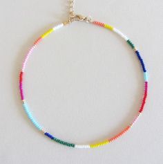 Beaded choker rainbow bead choker choker necklace hippie colorful choker boho chokers seed bead choker colorful beaded choker beach jewelry  These are multi-colored, opaque shiny beads of size 10/0. Please choose the length of the necklace clasp color from the drop down menu or request any length. Each necklace has a 2 inch extension chain. Adjustable Rainbow Choker Jewelry, Summer Spacer Bead Choker Jewelry, Rainbow Beaded Chain For Summer, Rainbow Beads With Beaded Chain For Summer, Bohemian Rainbow Jewelry For Summer, Adjustable Rainbow Beaded Necklaces For Summer, Summer Rainbow Beaded Chain Beads, Bohemian Rainbow Summer Jewelry, Rainbow Beaded Necklaces For Summer Festivals