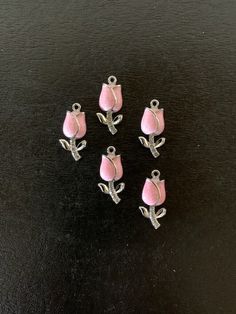 "5 pastel pink and silver tone tulip charms with rhinestone accents on stem, pink tulip charm, tulip charm, tulip pendant, tulip jewelry, pink flower charm, pink tulips, charms flower Choose pink or darker pink.   ★ Charm Size: 7/8\" L X 3/8\" W.           ★ More charms, beads, pendants, jewelry making supplies and buttons available at https://www.etsy.com/shop/ElevenWestDesigns" Pink Flower Charm Necklace With Flower Pendant, Pink Flower Pendant Jewelry With Charms, Tulip Jewelry, Pink Charm, Pink And Silver, Pink Tulips, Flower Charm, Pink Flower, Jewelry Making Supplies