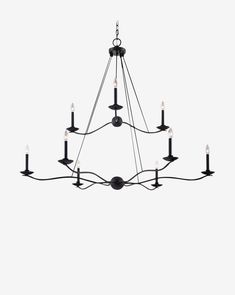 a black chandelier with eight candles hanging from it's center, on a white background