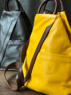 A great way to add color to your outfit!  This Italian leather backpack is fun and functional. Lots of zip pockets and a zip closure to keep your valuables secure. Great gift for a traveler or that adventurous soul! #backpackbags #travelbags #travelbagsforwomen #giftforher #giftideas #pursebag  #yellowleatherpurse #yellowfashion #fashionbackpacksbags #fashionbackpackspurse Versatile Leather Backpack With Cell Phone Pocket, Versatile Leather Backpack With Cell Phone Pocket For Everyday, Trendy Leather Backpack With Cell Phone Pocket, Versatile Brown Backpack With Cell Phone Pocket, Leather Travel Backpack With Cell Phone Pocket, Leather Backpack With Cell Phone Pocket For Travel, Versatile Daily Backpack With Cell Phone Pocket, Modern Leather Backpack For Travel With Cell Phone Pocket, Modern Leather Backpack With Cell Phone Pocket For Travel