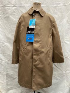 French vintage, beige school Mac, rain coat. Dead-stock with tags  Made in France.  Excellent quality. 67% cotton, 33% polyester  Fly-front button closure to front, 2 front pockets, centre vent Mint un-worn condition, no damage. Beautiful finish to fabric Shoulder 13.5 inches Chest 32 inches Sleeve 17.5 inches Length 27.5 inches Measurements are taken with the item flat. Please compare sizing with a garment you already own to be exact. Thank you for looking, convo me with any questions. ------------------------------- We specialise in NOS and pre-owned French workwear and have many items in stock so if you want something particular please ask.  Wholesale and bundle enquiries welcomed. I combine shipping and always provide refunds and deals on multiple purchase Buy with full confidence. We Classic Solid Raincoat With Pockets, Classic Solid Raincoat With Button Closure, School Coat, Mac Coat, French Workwear, Stylish Mens Outfits, Men Style Tips, Rain Coat, French Vintage