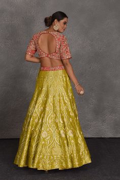 Flaunt your Indian style on festive and wedding occasions in this yellow and red hand embroidered Banarasi lehenga. The lehenga comes with a dupatta. DISCLAIMER: The actual product may vary slightly from the image. These are custom orders, hence expect slight variation in color and placement of the motif or buta. ESTIMATED DELIVERY: Because this is a custom order, it would take about 4 weeks from the date of purchase. RETURN POLICY: This product is a custom order and cannot be returned or exchan Suit Sharara, Lehenga With Dupatta, Sharara Suits, Embroidered Sarees, Designer Lehengas, Lehenga Online, Fashion Journals, Traditional Fabric, Anarkali Suit