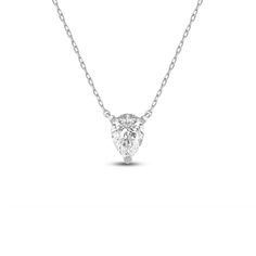 Add instant glamour to your daily wear with this pear solitaire necklace. The white gold pendant features a stylized three-prong basket securing pear-cut diamond that points downwards. This necklace delivers a subtle sparkle that can go from office to evening wear with ease. Solitaire Necklace, White Gold Pendant, Pear Cut Diamond, Solitaire Necklaces, Pear Cut, Lab Created Diamonds, Evening Wear, Gold Pendant, The White