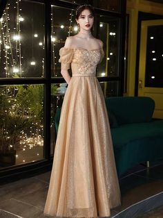 Glamorous Off-shoulder Evening Dress For Wedding, Glamorous Off-shoulder Wedding Evening Dress, Off-shoulder Evening Dress For Gala And Prom Season, Glamorous Off-shoulder Prom Evening Dress, Glamorous Off-shoulder Ball Gown For Prom, Glamorous Off-shoulder Ball Gown For Gala, Glamorous Off-shoulder Wedding Ball Gown, Gold Dress With Sweetheart Neckline For Banquet, Glamorous Off-shoulder Evening Dress For Banquet