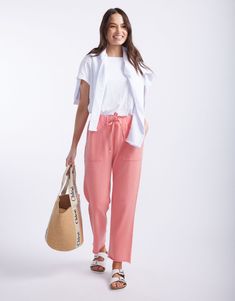 DESCRIPTION Add a pop of colour to your casual wardrobe with the Raw Edge Lounge Pants in Washed Melon by White & Co. The Label. These comfy French Terry lounge pants feature a relaxed fit with a straight leg and raw hem for a laid-back vibe. The elastic waistband with a drawstring tie ensures a snug fit, while the large front patch pockets add both style and functionality. Perfect for lazy days at home or running errands in style. Pair these lounge pants with a simple white tee and your favouri Relaxed Tapered Leg Sweatpants For Summer, Casual Sweatpants With Pockets For Day Out, Pink Relaxed Fit Bottoms, Everyday Summer Sweatpants With Tapered Leg, Summer Tapered Leg Sweatpants For Everyday, Everyday Sweatpants With Pockets, Casual Tapered Leg Sweatpants For Summer, Relaxed Pink Bottoms For Spring, Casual Pink Ankle-length Sweatpants