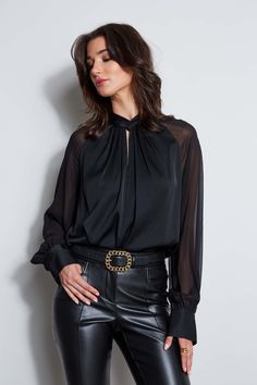 It's all in the details! Chic & modern, the twisted neck, softly gathered bodice & transparent chiffon sleeves of our luxe Silk Georgette shirt gives it an artistic edge. Dress it down with jeans or up with Crepe Pants. Elie Tahari Exclusive Long Sleeve Silk Georgette Shirt with Twist Neck & Keyhole Detail 91% Silk, 9% Spandex Relaxed Fit; Runs true to size Model is 5'9" and wearing size S Dry Clean Only Imported Style #: ETR44209 Chic Sheer Sleeve Blouse For Work, Chic Evening Blouse With Gathered Sleeves, Chic Evening Tops With Mesh Sleeves, Chic Blouse With Sheer Sleeves For Office, Fall Evening Blouse With Gathered Sleeves, Evening Blouse With Gathered Sleeves For Fall, Trendy Sheer Blouse For Fall, Sheer Sleeves Chic Fall Tops, Chic Blouse With Sheer Sleeves For Night Out