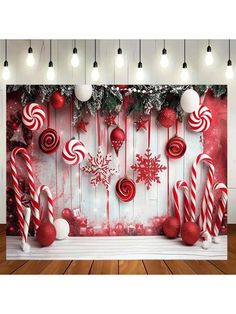 christmas decorations and candy canes hanging on a wall