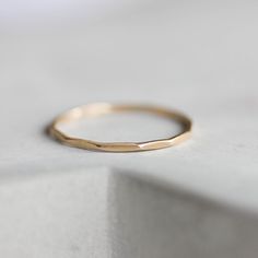 This stacking ring is a simple but yet beautiful jewel for your inner minimalist. It is a gentle and delicate piece, which you may wear alone or stacked. It is a great every-day jewel which will perfectly suit any occasion and any outfit. The ring is 0.8-0.9 mm thick. It's relatively sturdy for such a skinny band. Choose the material for the ring (sterling silver or 9k gold). You may order the ring of any size. If you are not sure about the size, this will be helpful: findmyringsize.com/ If you Simple Hammered 14k Gold Rings, Minimalist Hammered 14k Gold Stackable Rings, Dainty Hammered 14k Gold Rings, Dainty 14k Gold Hammered Rings, Dainty 14k Gold Midi Rings With Diamond Cut, Everyday Minimalist Diamond Cut Ring, Minimalist 14k Gold Rings With Diamond Cut, Minimalist 14k Gold Diamond Cut Rings, Minimalist Rose Gold Stackable Rings With Diamond Cut