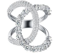 When it comes to luxurious looks, this chic and shapely ring proves less is more with its sophisticated use of space and sparkle. Elegant Sparkling Cubic Zirconia Crystal Ring, Luxury Sparkling Diamond Promise Ring, Elegant Crystal Ring With Sparkle For Formal Occasions, Elegant Sparkling Crystal Promise Ring, Elegant Sparkling Round Cut Crystal Ring, Elegant Sparkling Crystal Ring For Formal Occasions, Elegant Open Ring Jewelry For Party, Glamorous White Gold Ring, Elegant Wedding Rings With Sparkling Stones