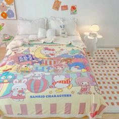 a bed with hello kitty comforter and pillows